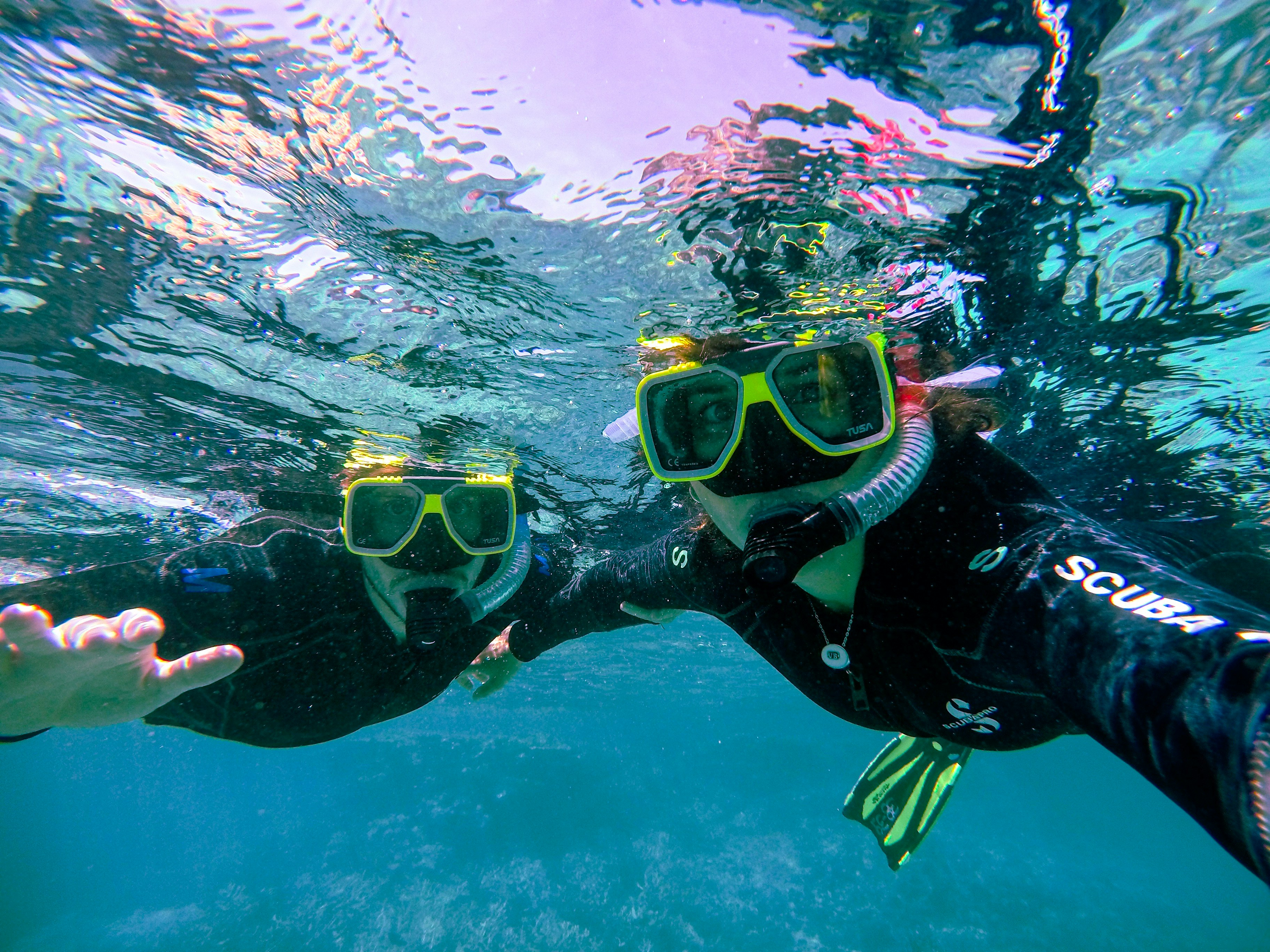 Snorkeling couple underwater Maui Hawaii